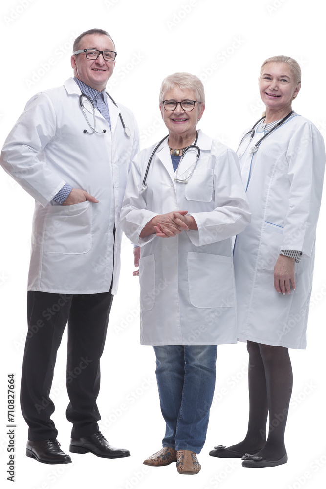 in full growth. friendly female doctor and her colleagues standing together in full growth. friendly female doctor and her colleagues standing together