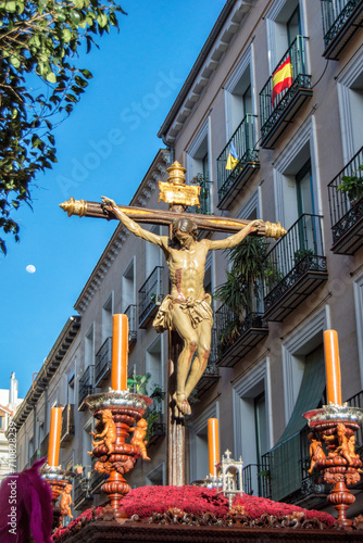 Image of Christ processioning through a street in Madrid during Holy Week