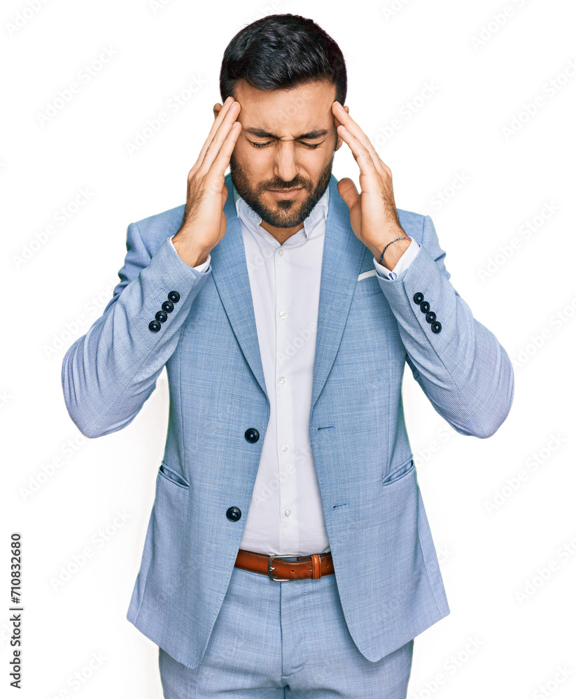 Young hispanic man wearing business jacket suffering from headache desperate and stressed because pain and migraine. hands on head. Young hispanic man wearing business jacket suffering from headache desperate and stressed because pain and migraine. hands on head.
