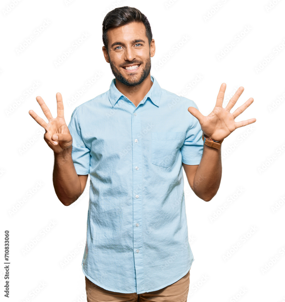 Handsome hispanic man wearing casual clothes showing and pointing up with fingers number eight while smiling confident and happy. Handsome hispanic man wearing casual clothes showing and pointing up with fingers number eight while smiling confident and happy.