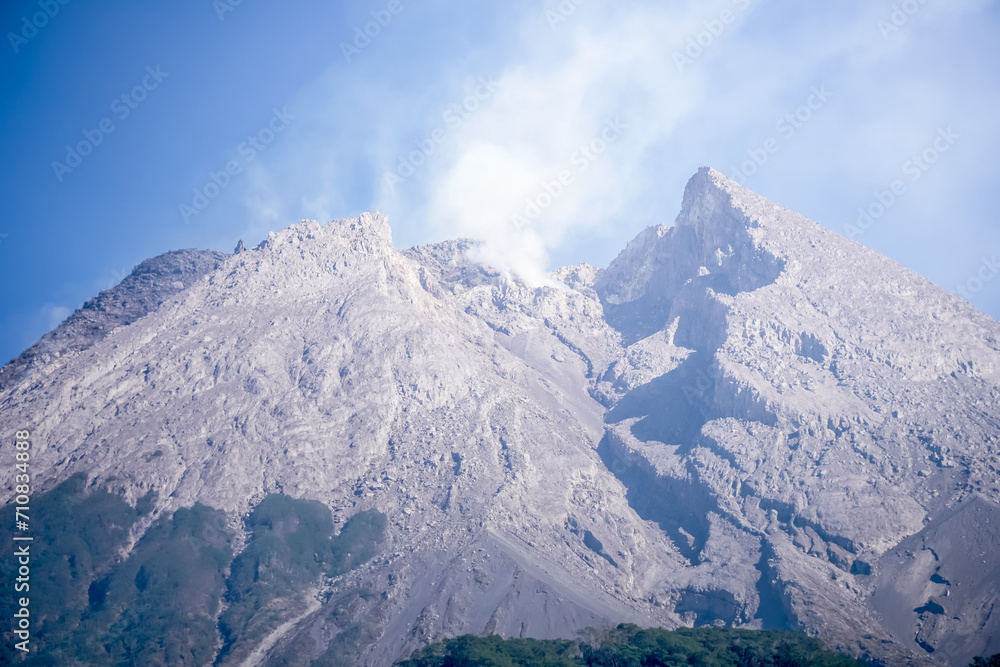 Close up photo of Merapi Volcano crater with volcanic smoke. Cracked Merapi Mountain in Cangkringan, Sleman, Yogyakarta, Indonesia. Concept for geology and natural disaster.