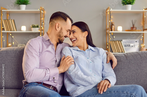 Happy people in love expression sitting close, showing romantic moment feelings. Valentine day emotion, loving male, female couple filled with happiness, family pair trust, respect between partners