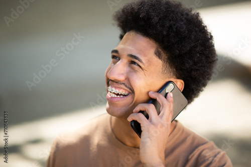 African American man talks on his mobile phone
