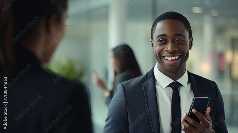dynamic essence of a smiling young African American businessman engaged in a professional mobile call, showcasing the modern, energetic vibe of corporate communication in an office setting dynamic essence of a smiling young African American businessman engaged in a professional mobile call, showcasing the modern, energetic vibe of corporate communication in an office setting