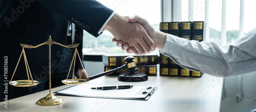Handshake after consultation between a male lawyer and client, giving advice and prosecutions about the regarding estate photo