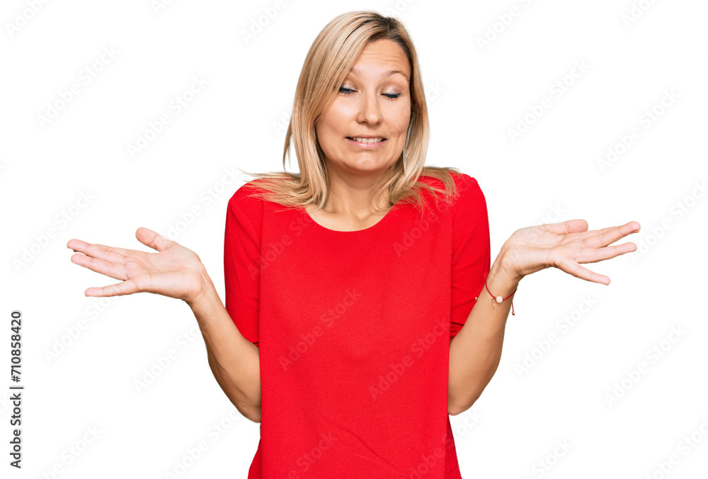 Middle age caucasian woman wearing casual clothes clueless and confused expression with arms and hands raised. doubt concept. Middle age caucasian woman wearing casual clothes clueless and confused expression with arms and hands raised. doubt concept.