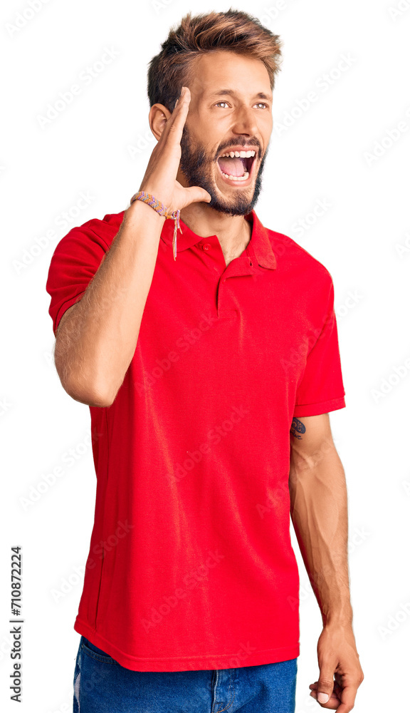 Handsome blond man with beard wearing casual clothes shouting and screaming loud to side with hand on mouth. communication concept. Handsome blond man with beard wearing casual clothes shouting and screaming loud to side with hand on mouth. communication concept.