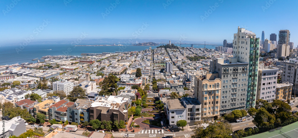 Panoramic view of aerial Lombard Street, an east west street in San Francisco, California. Famous for steep, one block section with eight hairpin turns. Crookedest, steep hills, sharp curves