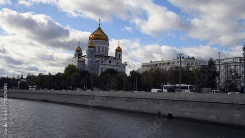 View from sailing tourboat of Russian orthodox Cathedral of Christ the Saviour in a cloudy autumn day in Moscow, Russia. Soft focus. Real time handheld video. Travel in Russia theme.