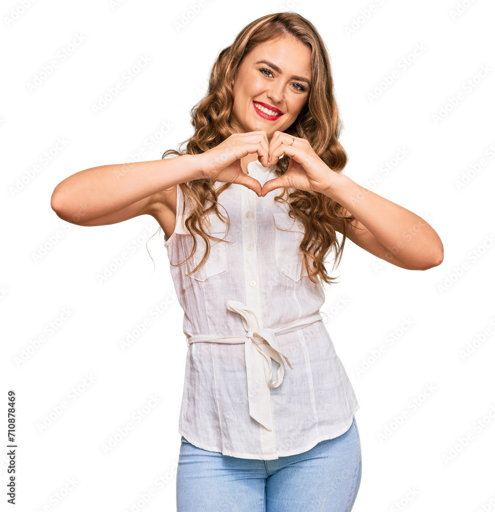 Young blonde girl wearing casual clothes smiling in love doing heart symbol shape with hands. romantic concept. Young blonde girl wearing casual clothes smiling in love doing heart symbol shape with hands. romantic concept.