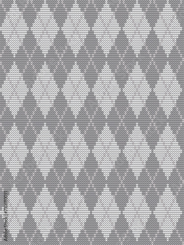 Argyle gray print. Seamless knitted pattern with rhombuses. Checkered background in gray and white colors. Vector illustration