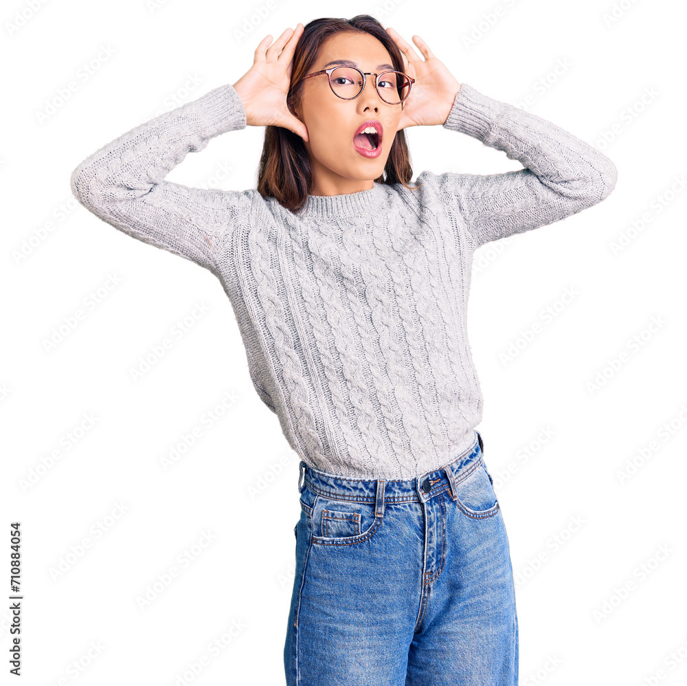 Young beautiful chinese girl wearing casual clothes smiling cheerful playing peek a boo with hands showing face. surprised and exited Young beautiful chinese girl wearing casual clothes smiling cheerful playing peek a boo with hands showing face. surprised and exited