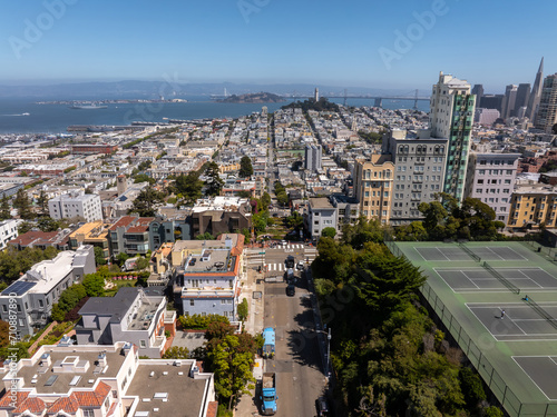 Panoramic view of aerial Lombard Street, an east west street in San Francisco, California. Famous for steep, one block section with eight hairpin turns. Crookedest, steep hills, sharp curves