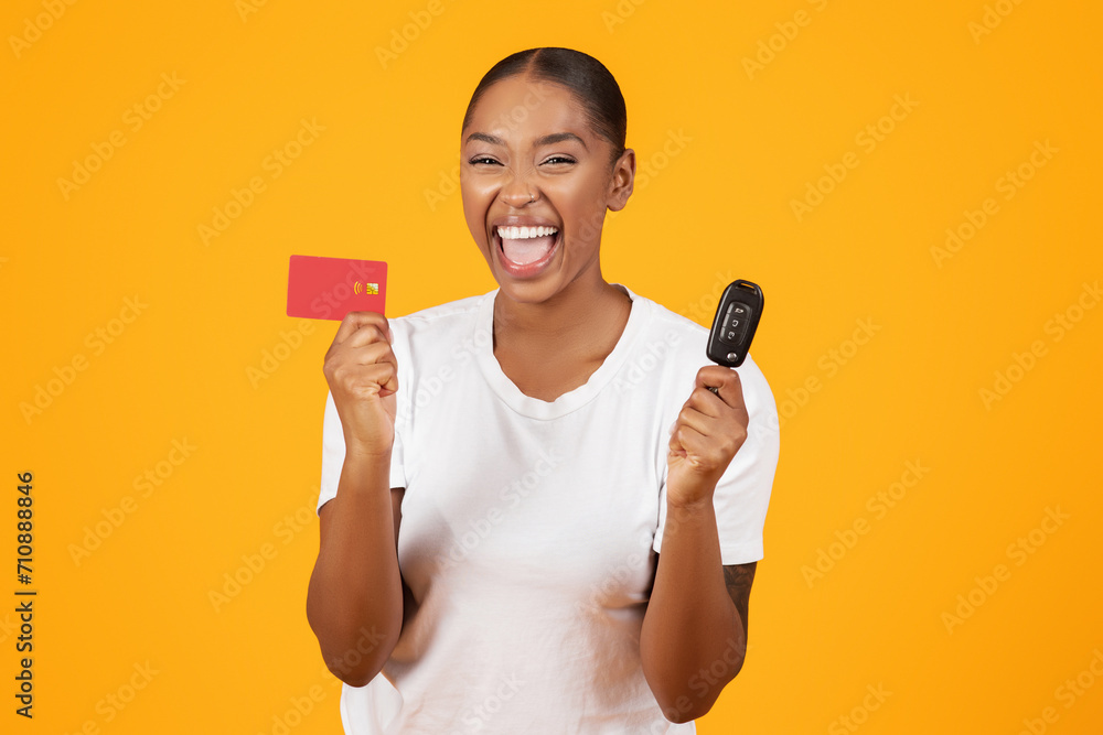 Black Woman Holds New Car Key And Credit Card, Studio Black Woman Holds New Car Key And Credit Card, Studio