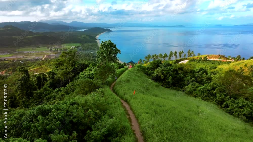 Aerial view of a scenic road along the coastline with high cliffs and beautiful beach in San Vicente Viewpoint, Palawan, Philippines. Aerial view of a scenic road along the coastline with high cliffs and beautiful beach in San Vicente Viewpoint, Palawan, Philippines.