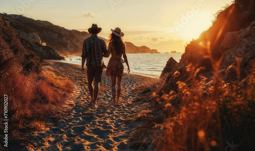 A young couple dressed in bohemian beach wear, embracing on a sandy beach, evoking a sense of summer love.