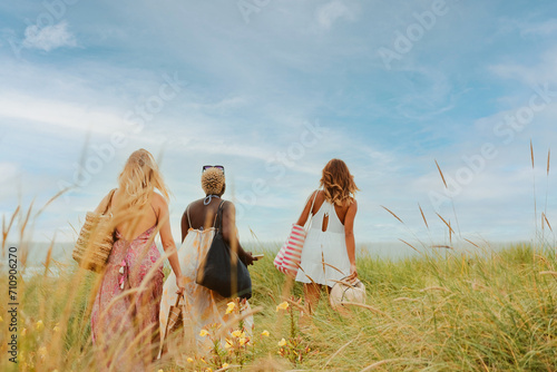 multiracial group of young women on the beach
