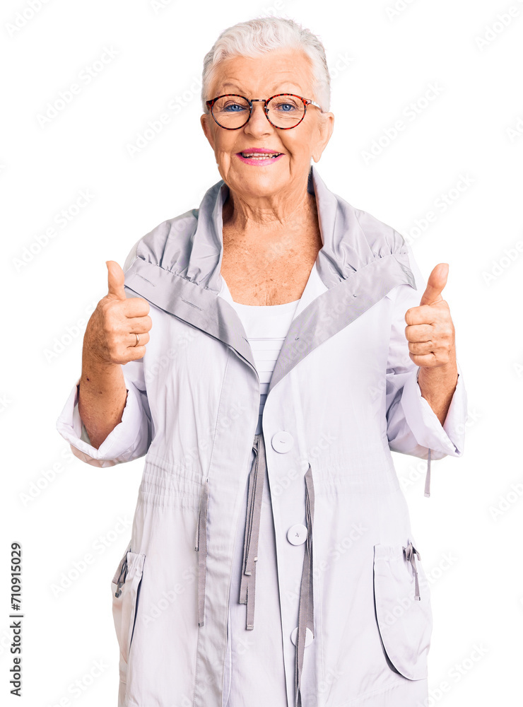 Senior beautiful woman with blue eyes and grey hair wearing casual clothes and glasses success sign doing positive gesture with hand, thumbs up smiling and happy. Senior beautiful woman with blue eyes and grey hair wearing casual clothes and glasses success sign doing positive gesture with hand, thumbs up smiling and happy.