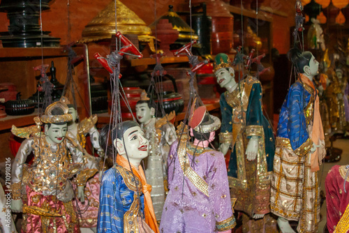 colorful traditional buddhist decorated marionettes with jewelry