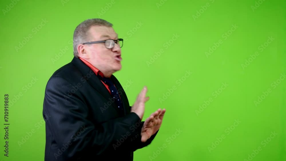 Disgruntled senior man in black suit scream angry no, as sign of disapproval.