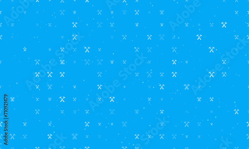 Seamless background pattern of evenly spaced white crossed hammers symbols of different sizes and opacity. Vector illustration on light blue background with stars