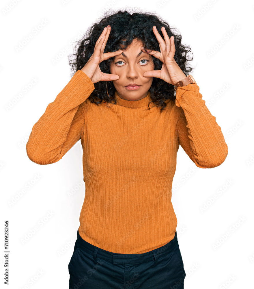 Young hispanic woman wearing casual clothes trying to open eyes with fingers, sleepy and tired for morning fatigue Young hispanic woman wearing casual clothes trying to open eyes with fingers, sleepy and tired for morning fatigue