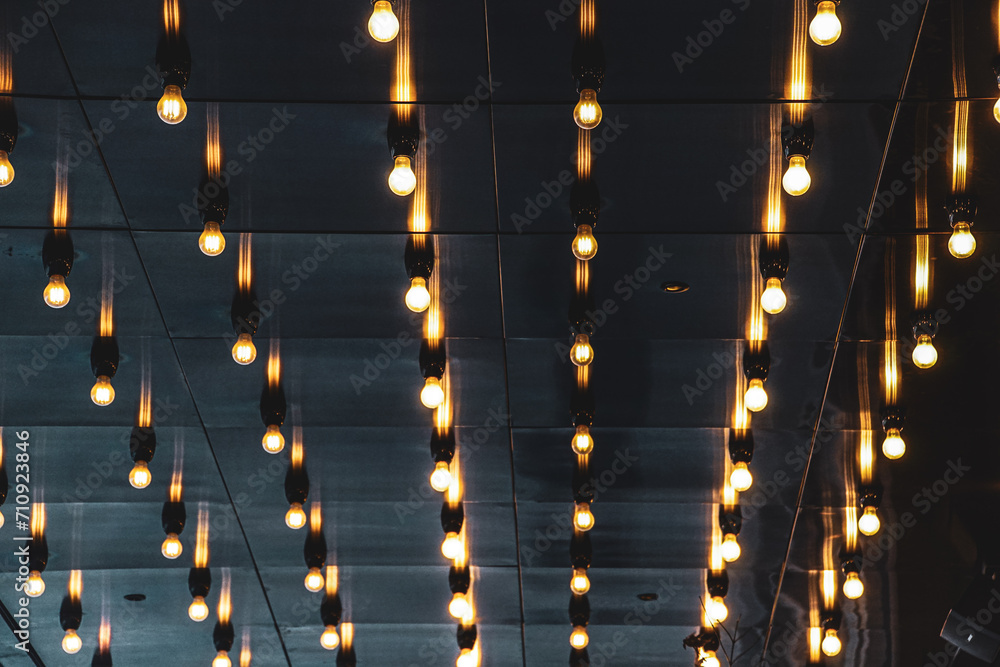 Low angle view of electric lights on the ceiling - obrazy, fototapety, plakaty 