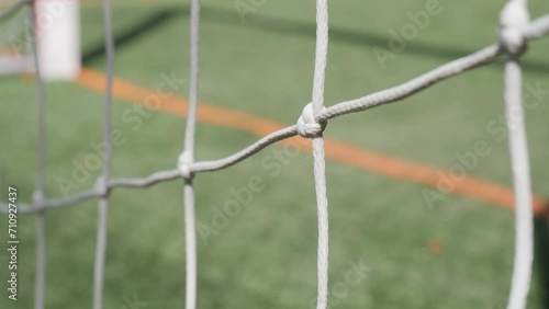 
Close-up of the goal net on the school playground. Video showing a slightly moving goal net on the pitch.
