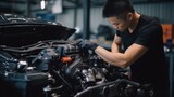 The adept Asian master, hands-on, meticulously attends to car engine repairs in the foreground of a light-colored car service