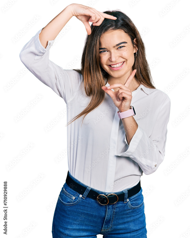 Young caucasian girl wearing casual white shirt smiling making frame with hands and fingers with happy face. creativity and photography concept. Young caucasian girl wearing casual white shirt smiling making frame with hands and fingers with happy face. creativity and photography concept.