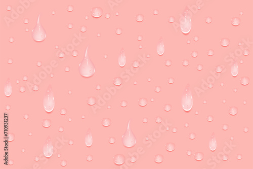 Liquid pink wet drops of gel or collagen.Spilled puddles of cosmetic serum or water. Round clean swatch of essence lotion or jelly for skin care.Beauty background with oil drops.