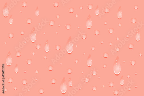 Liquid pink wet drops of gel or collagen.Spilled puddles of cosmetic serum or water. Round clean swatch of essence lotion or jelly for skin care.Beauty background with oil drops.