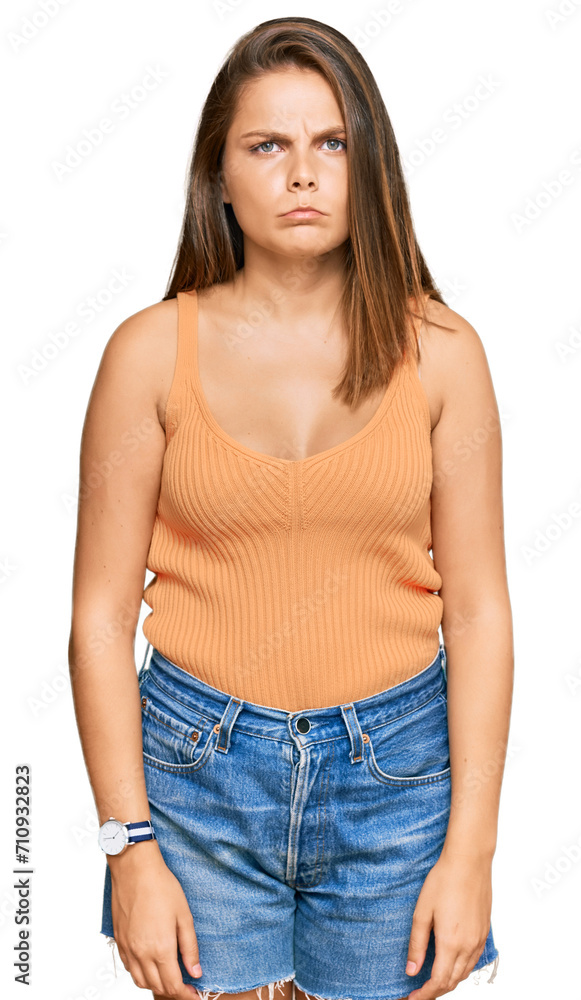 Young caucasian woman wearing casual clothes skeptic and nervous, frowning upset because of problem. negative person. Young caucasian woman wearing casual clothes skeptic and nervous, frowning upset because of problem. negative person.