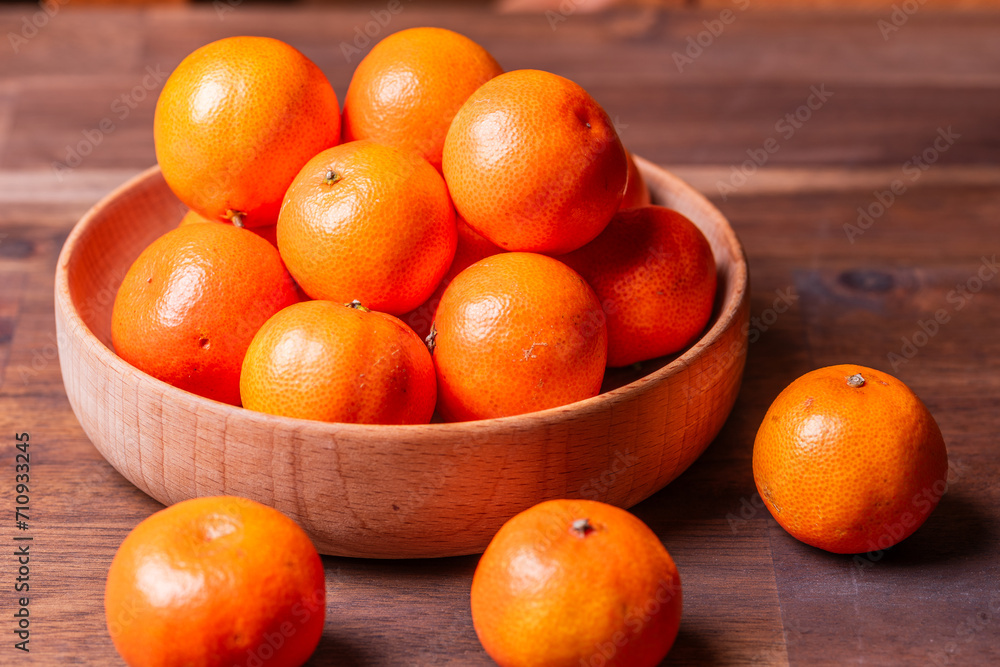 clementine mandarin fruit. mandarins in the wooden bowl. clementine mandarin fruit. mandarins in the wooden bowl.