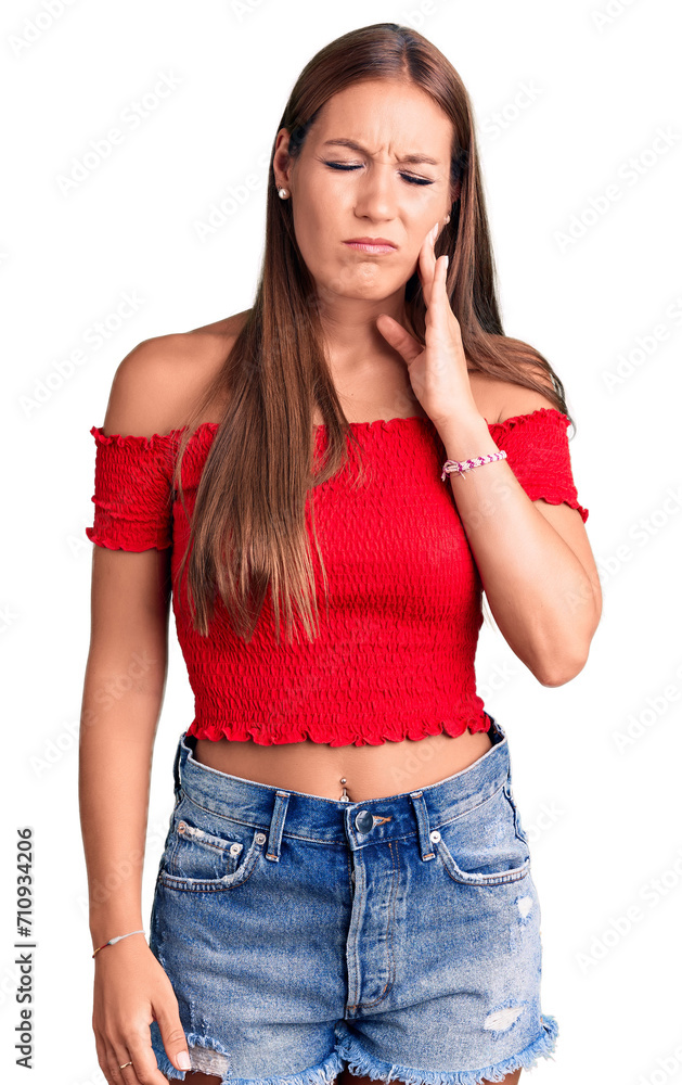 Young beautiful hispanic woman wearing casual clothes touching mouth with hand with painful expression because of toothache or dental illness on teeth. dentist Young beautiful hispanic woman wearing casual clothes touching mouth with hand with painful expression because of toothache or dental illness on teeth. dentist