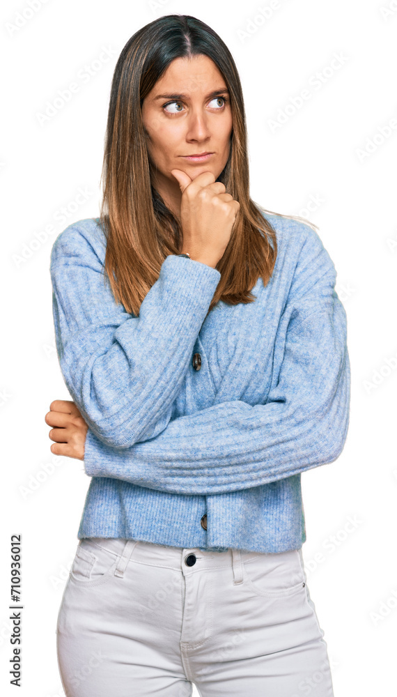 Young woman wearing casual clothes with hand on chin thinking about question, pensive expression. smiling with thoughtful face. doubt concept. Young woman wearing casual clothes with hand on chin thinking about question, pensive expression. smiling with thoughtful face. doubt concept.