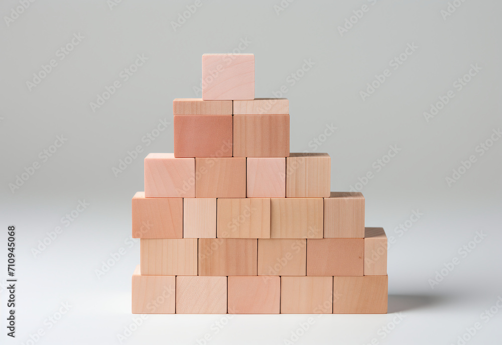 Empty blank wooden cube blocks build pyramid shape with the big one on top, isolated on wood desk on white background. Business growth process, education, success buildings and organization concepts. Empty blank wooden cube blocks build pyramid shape with the big one on top, isolated on wood desk on white background. Business growth process, education, success buildings and organization concepts.