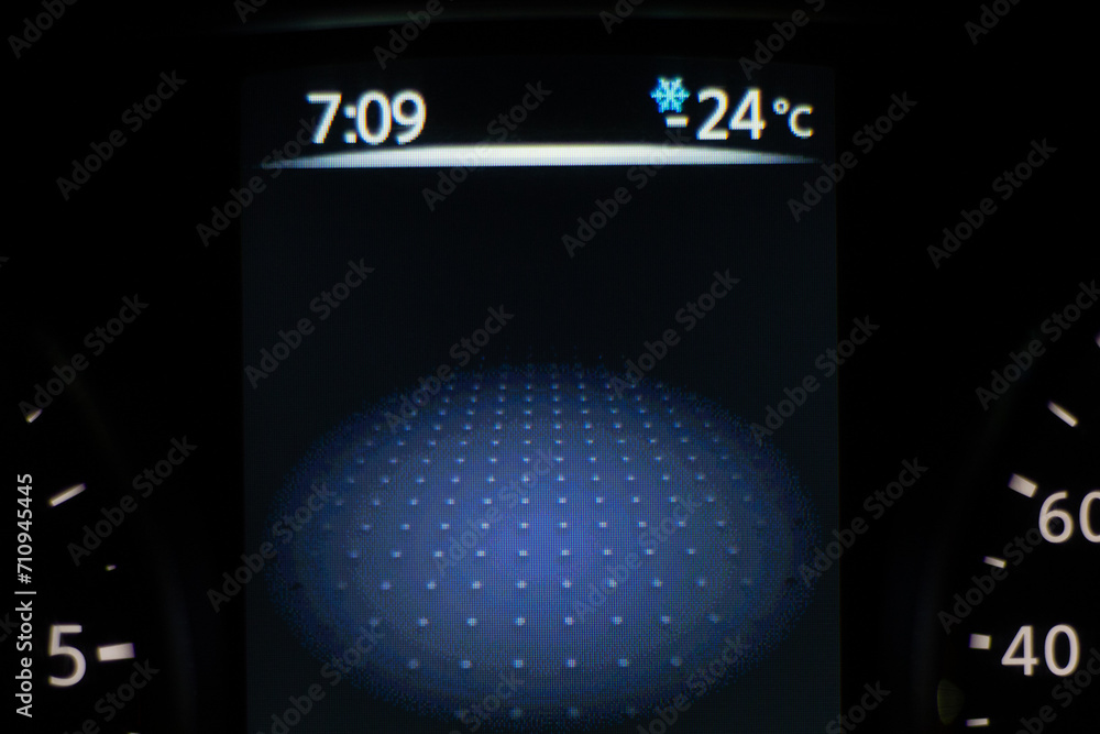 Car dashboard lights showing speed and temperature. Car instrument