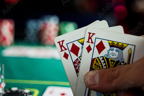 A close-up of the winner's cards, who revealed two kings at the casino poker championship. A professional player accepts congratulations from his rivals
