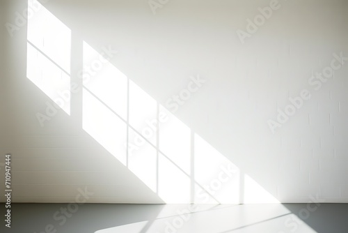 Abstract white studio background for product presentation. Empty room with shadows of window. Display product with blurred backdrop. 