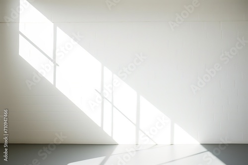 Abstract white studio background for product presentation. Empty room with shadows of window. Display product with blurred backdrop. 
