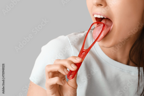 Young woman with tongue scr...