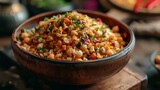 Bulgur with chickpeas and vegetables in a wooden bowl.