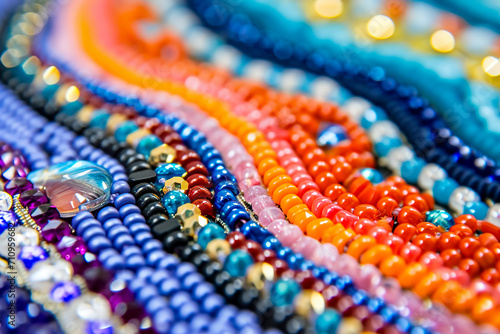 close-up of a beaded earring, with different colored beads arranged in a pattern photo