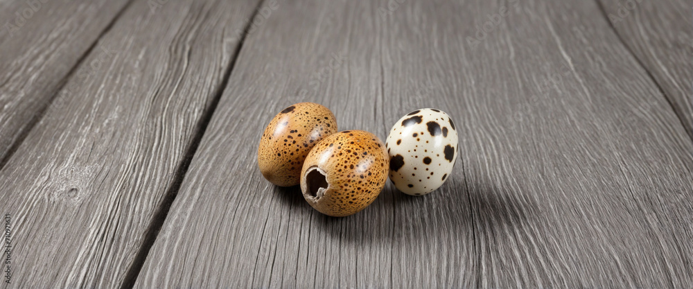 Quail eggs on rustic wooden backdrop, wide banner size Quail eggs on rustic wooden backdrop, wide banner size