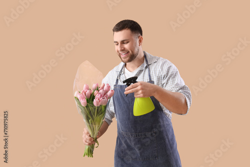 Male florist with tulips an...