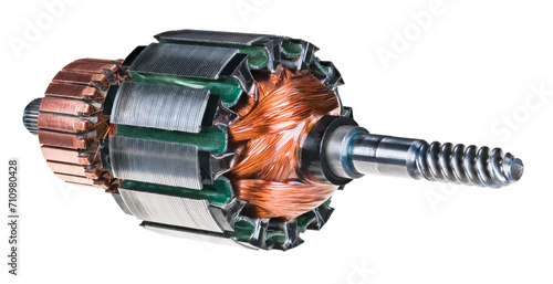 Closeup an electric DC motor rotor isolated on a white background. Steel worm gear shaft, commutator copper segments and coil wire winding or metal transformer sheets on electrical machine moving part