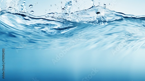 The surface of the water is transparent and features ripples  waves  and splashes. the background has space for copying.