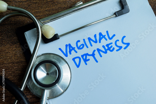фотографія Concept of Vaginal Dryness write on paperwork with stethoscope isolated on wooden background