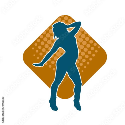 Silhouette of a female dancer in action pose. Silhouette of a woman dancing happily.